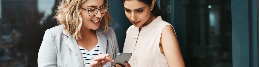 two persons looking to a screen in a callcenter